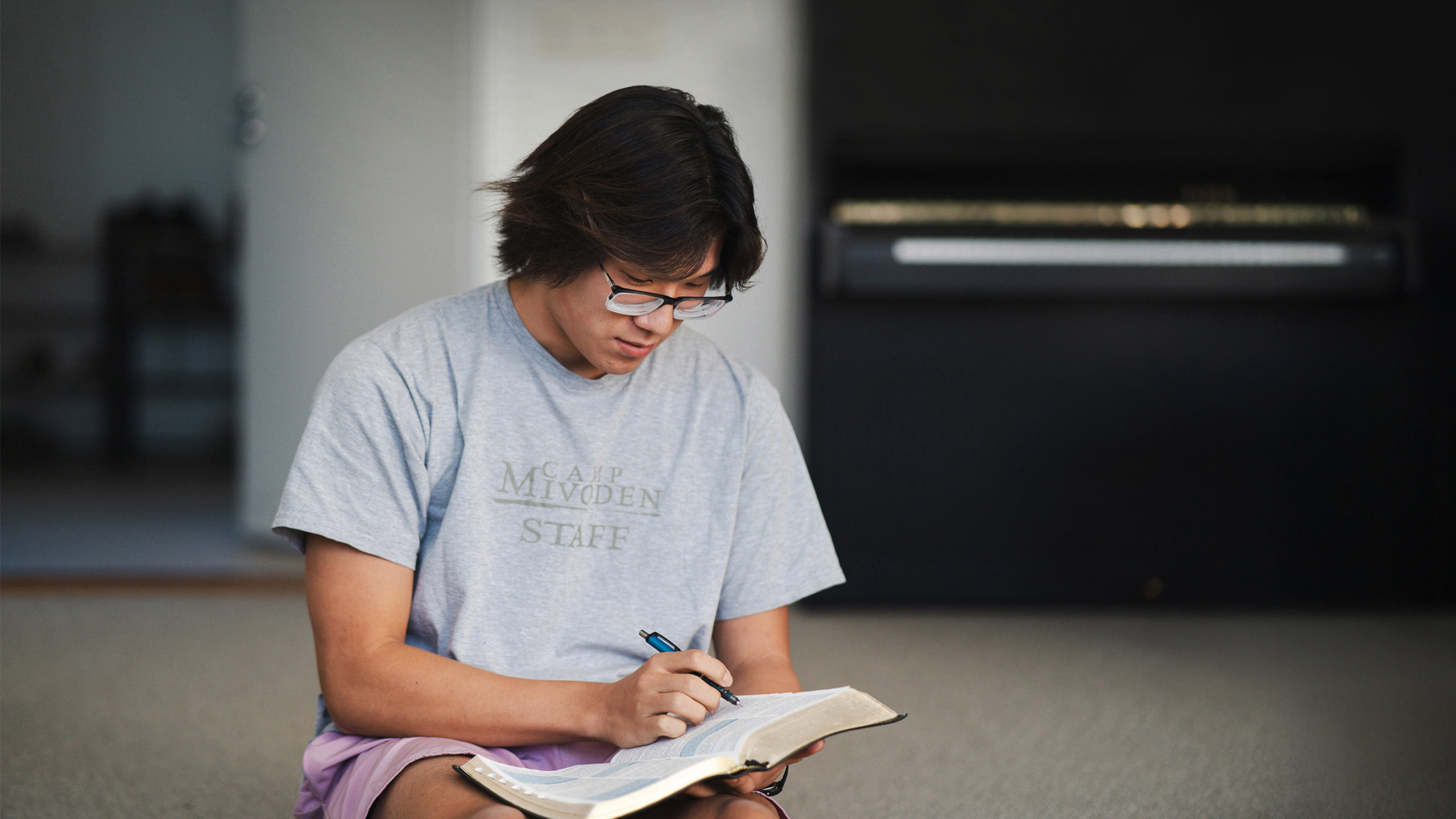 Justin Chung reading a book